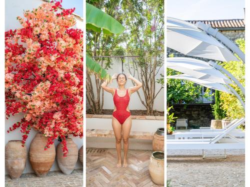 a woman in a red dress standing next to a bunch of flowers at Secret d'Uzès - Le Duché - Piscine chauffée et Jacuzzi in Uzès