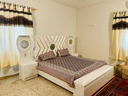 Ένα ή περισσότερα κρεβάτια σε δωμάτιο στο Rose Grand