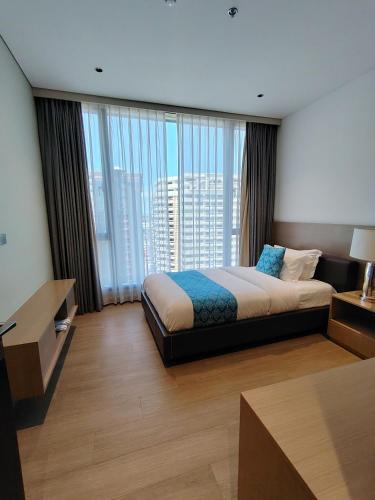 Postel nebo postele na pokoji v ubytování Bayprime Hotel