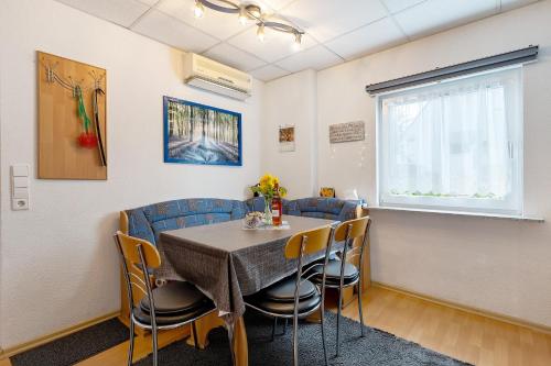 a dining room with a table and chairs at Ferienwohnung, 50qm, Terrasse in Sexau