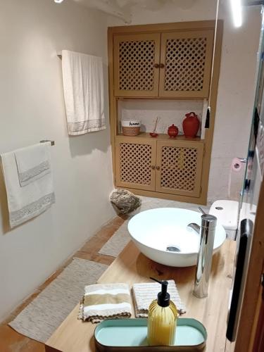 a bathroom with a white sink and a counter at El Paraje de la Platera in Bérchules