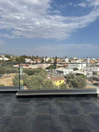 a balcony with a view of a city at Costas court in Limassol