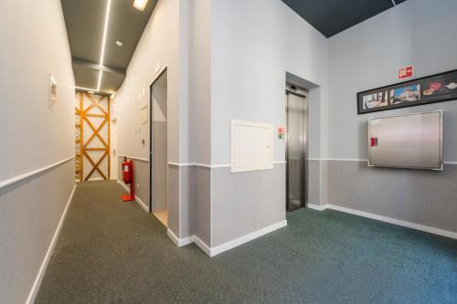 a hallway of an office with a door and a wall at Lisboa Prata Boutique Hotel in Lisbon
