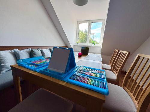 a room with a table with a laptop on it at Apartmán Miládka in Jáchymov