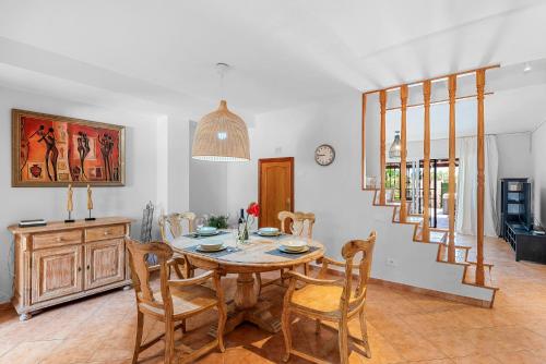 a dining room with a table and chairs at MEDANO4YOU Montaña Roja Beach House in El Médano