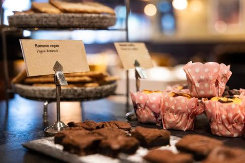 a display ofbrownies and cookies on a table at ProfilHotels Central in Stockholm