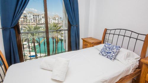 Postel nebo postele na pokoji v ubytování Marina Real 232