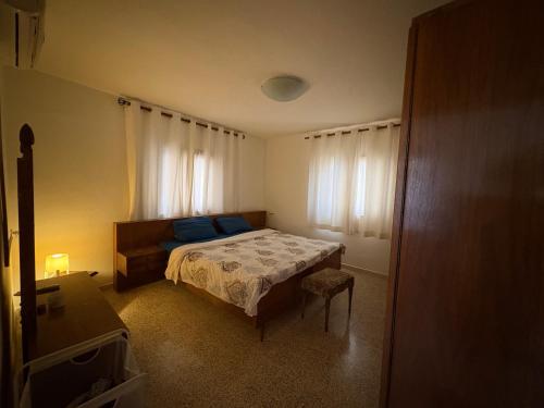 a bedroom with a bed and a window at Madaba Hills Apt in Madaba