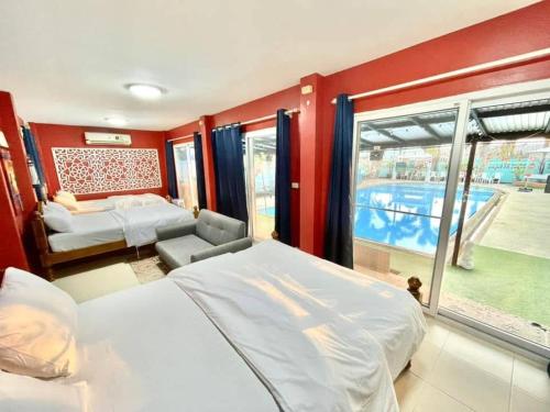Ένα ή περισσότερα κρεβάτια σε δωμάτιο στο Villa Na WanDe Sattahip