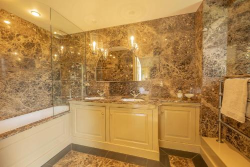 a bathroom with a sink and a shower at Drum Lodge in Nethy Bridge