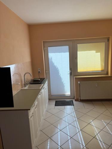a kitchen with a sink and a counter top at Ihr Kuschelnest in Wathlingen