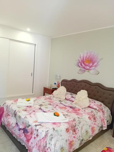 a bedroom with a bed with two plates of food on it at Al Punto Giusto in Catania