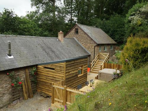 a barn with a staircase and a house at Burrills View in Horderley