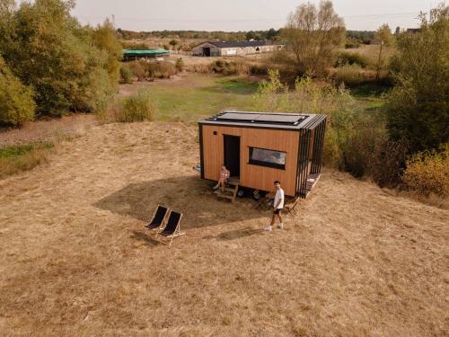 an aerial view of a man standing in front of a trailer at Homnest - L'Indiana Ranch - 20 min de Vichy in Espinasse-Vozelle