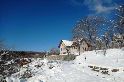 a house on top of a snow covered hill at Holiday Home in Bunjevci with Sauna & Garden in Vrbovsko