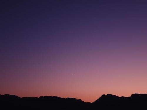 a view of the sunset over the mountains at Heaven Dune Camp in Nuweiba