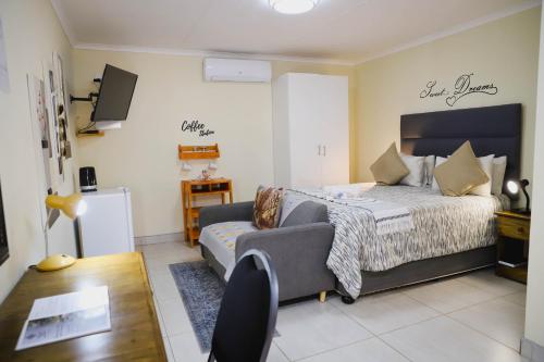 Ένα ή περισσότερα κρεβάτια σε δωμάτιο στο Maroela Guest Lodge
