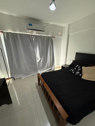 Ένα ή περισσότερα κρεβάτια σε δωμάτιο στο Loft Boutique Berazategui Centro