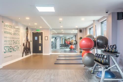 a gym with lots of exercise equipment in a hallway at The Edge in Central Station
