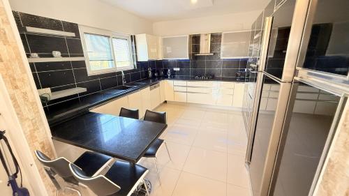 a kitchen with a table and chairs in it at Villa Ahmet Dalyan 4 bedrooms in Dalyan
