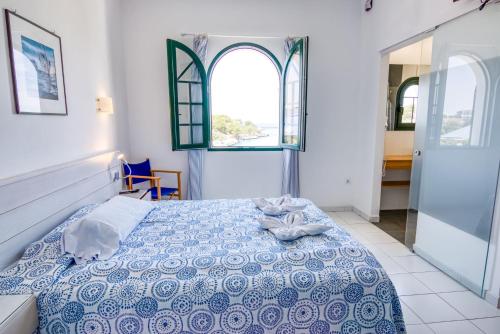 Ένα ή περισσότερα κρεβάτια σε δωμάτιο στο Hotel Bahia