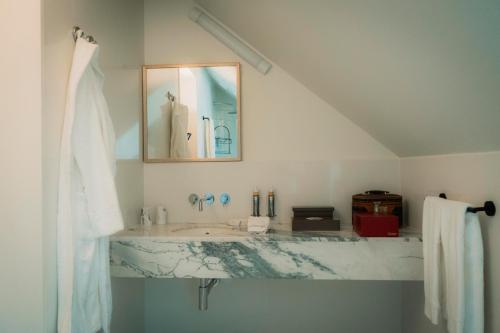 a bathroom with a sink and a mirror at Once Upon Lisboa in Lisbon