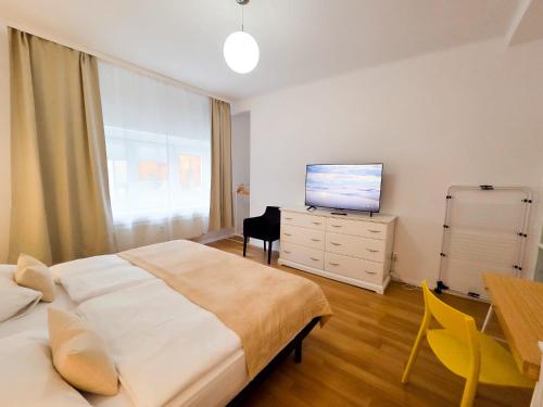 Ein Bett oder Betten in einem Zimmer der Unterkunft Petit Dependance