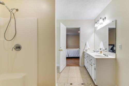 a bathroom with two sinks and a mirror at Classic Colonial Home with Private Yard in Richmond! in Beulah Village