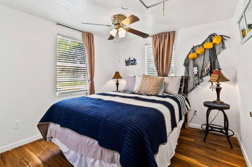a bedroom with a bed and a ceiling fan at Lake Livingston Retreat with Firepit, Fishing, and Game Room in Livingston