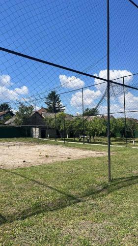 a net in a field with a soccer goal at Etno imanje Dorf in Ravno Selo