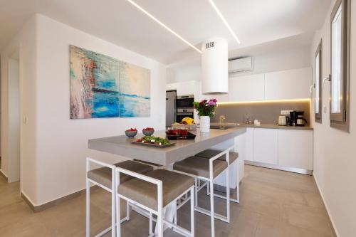 Η κουζίνα ή μικρή κουζίνα στο IL SOGNO VILLAS Paros