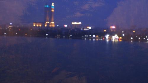 a view of a city at night with a city skyline at MD Hotel in Mỹ Lộc