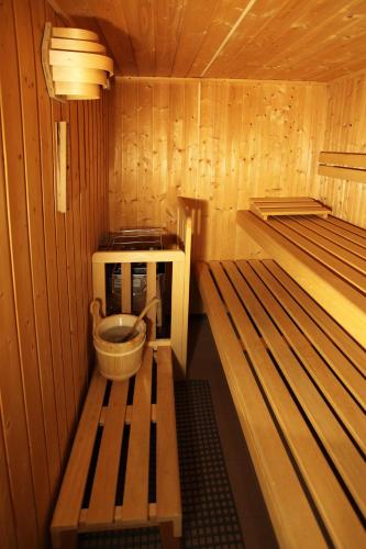 a inside of a sauna with a microwave and a bench at Haus Helga in Kappl