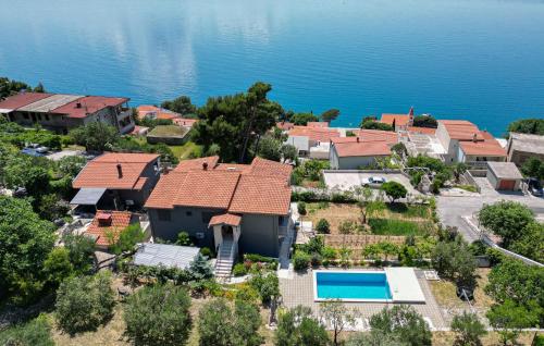 an aerial view of a house with a swimming pool at Stunning Home In Omis in Omiš