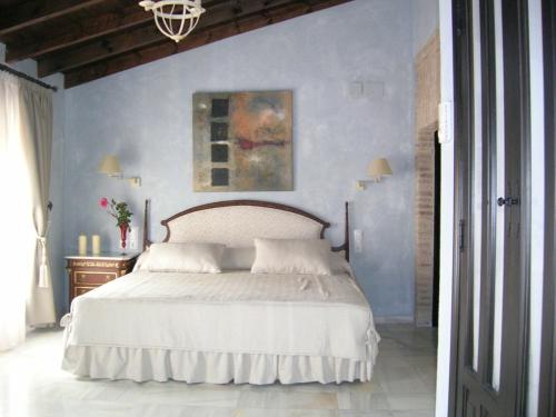A bed or beds in a room at Hacienda Los Jinetes