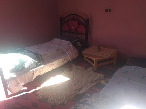 Ένα ή περισσότερα κρεβάτια σε δωμάτιο στο Bivouac beauté du désert