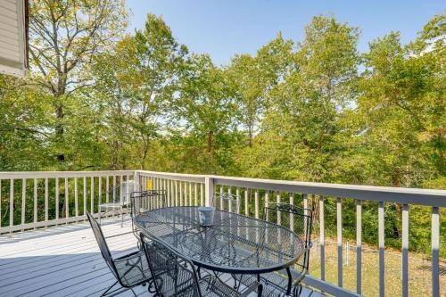 a glass table and chairs on a deck at Walk to Main Street! Family Home in Williamstown in Williamstown