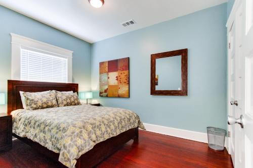 a bedroom with a bed and a mirror on the wall at Amazing Urban Oasis - Close to Everything in San Diego