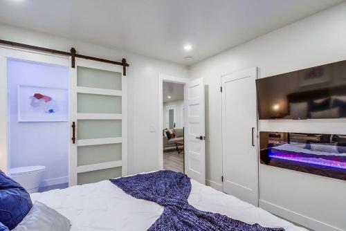 a bedroom with a bed with a fireplace in it at Lux Escape 1: Views Hot Tub Games Safari Tent in San Diego