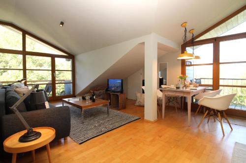 a living room with a couch and a table at Am Grün 15 Fewo 25 in Wittenbeck