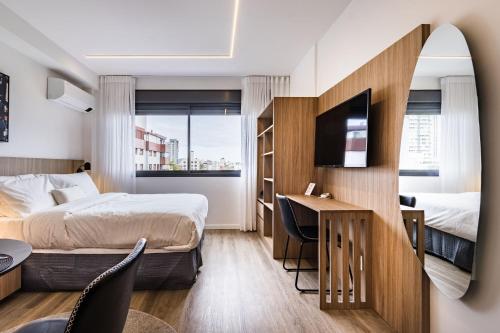 En eller flere senge i et værelse på Charlie Skyline Moinhos