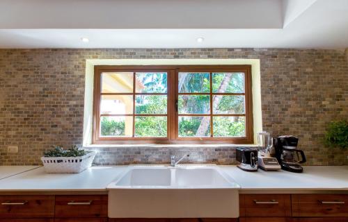 a kitchen with a sink and a window at Condo very close beach in Punta Cana
