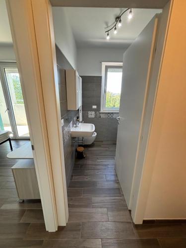 a bathroom with a sink and a toilet at Al Bivio Blu in Chieti