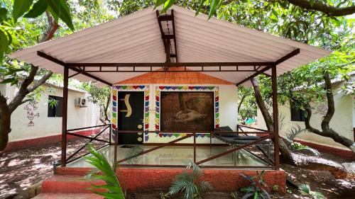 a building with a painting of an elephant on it at The Wilds Villa Gir Jungle Stay with Swimming Pool in Sasan Gir