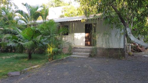 a small house with stairs leading up to it at The Wilds Villa Gir Jungle Stay with Swimming Pool in Sasan Gir
