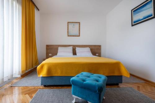 Postel nebo postele na pokoji v ubytování Apartmani Ina