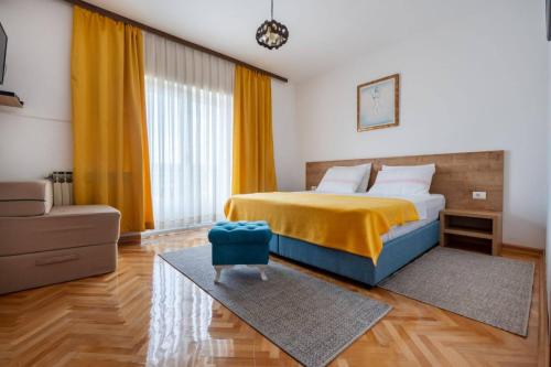 Postel nebo postele na pokoji v ubytování Apartmani Ina