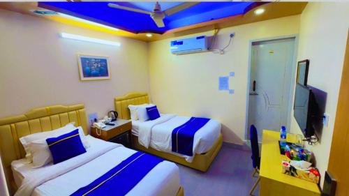 Кровать или кровати в номере The Ambassador Hotel Dhanmondi