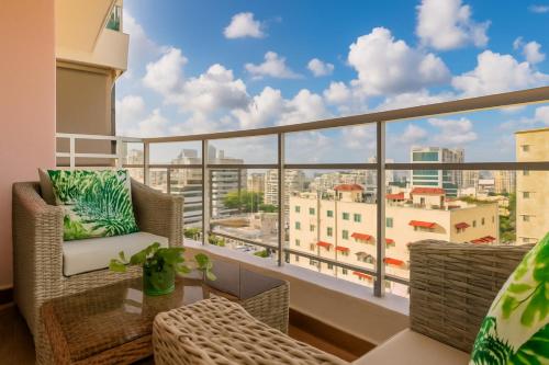 a balcony with a view of a city at Comfy 1BR Centric Apt King Bed in La Julia