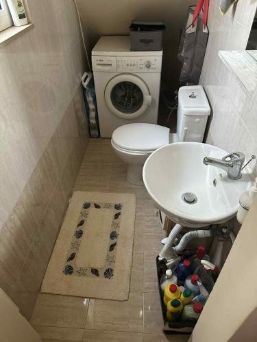 a small bathroom with a sink and a toilet at Sunny Garden in Koskinou